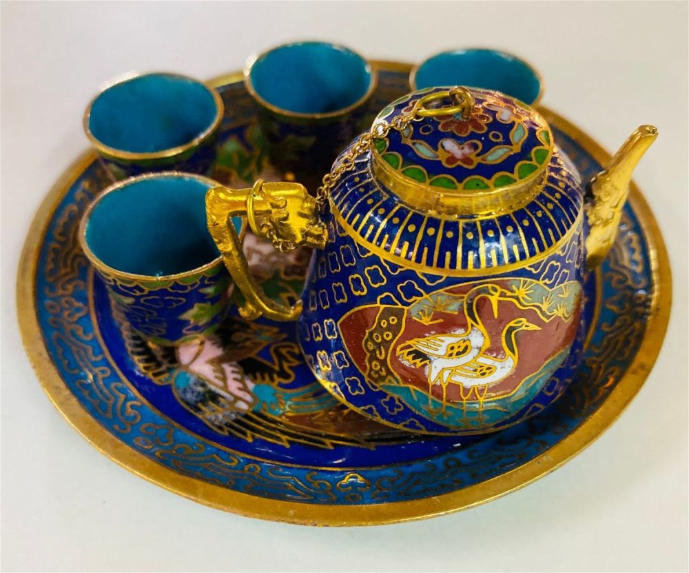 Lot 229: Enamel tea set miniature