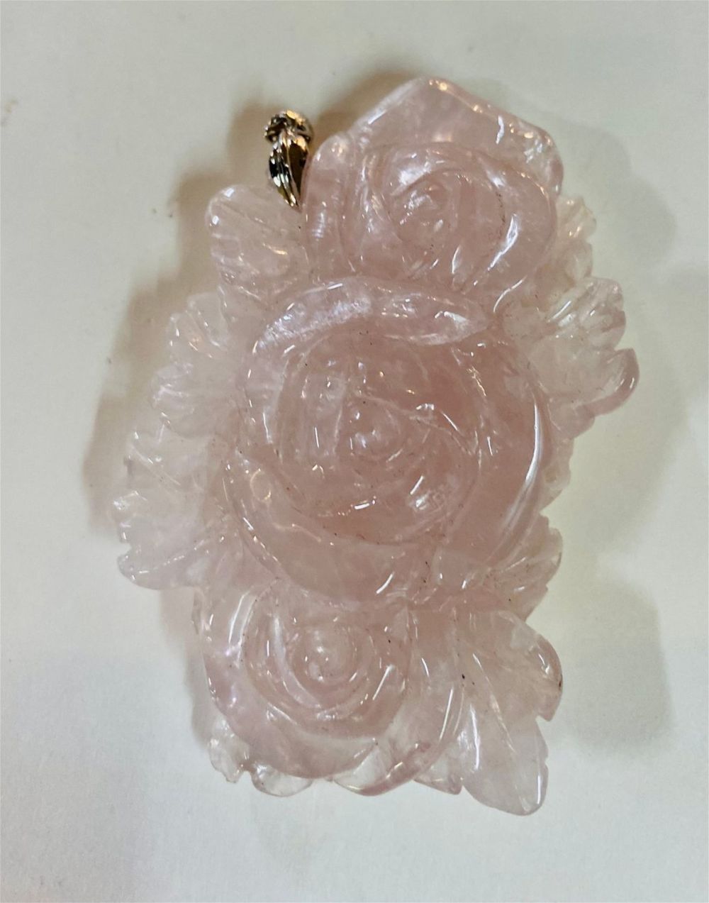 Lot 244: Carved rose quartz pendant