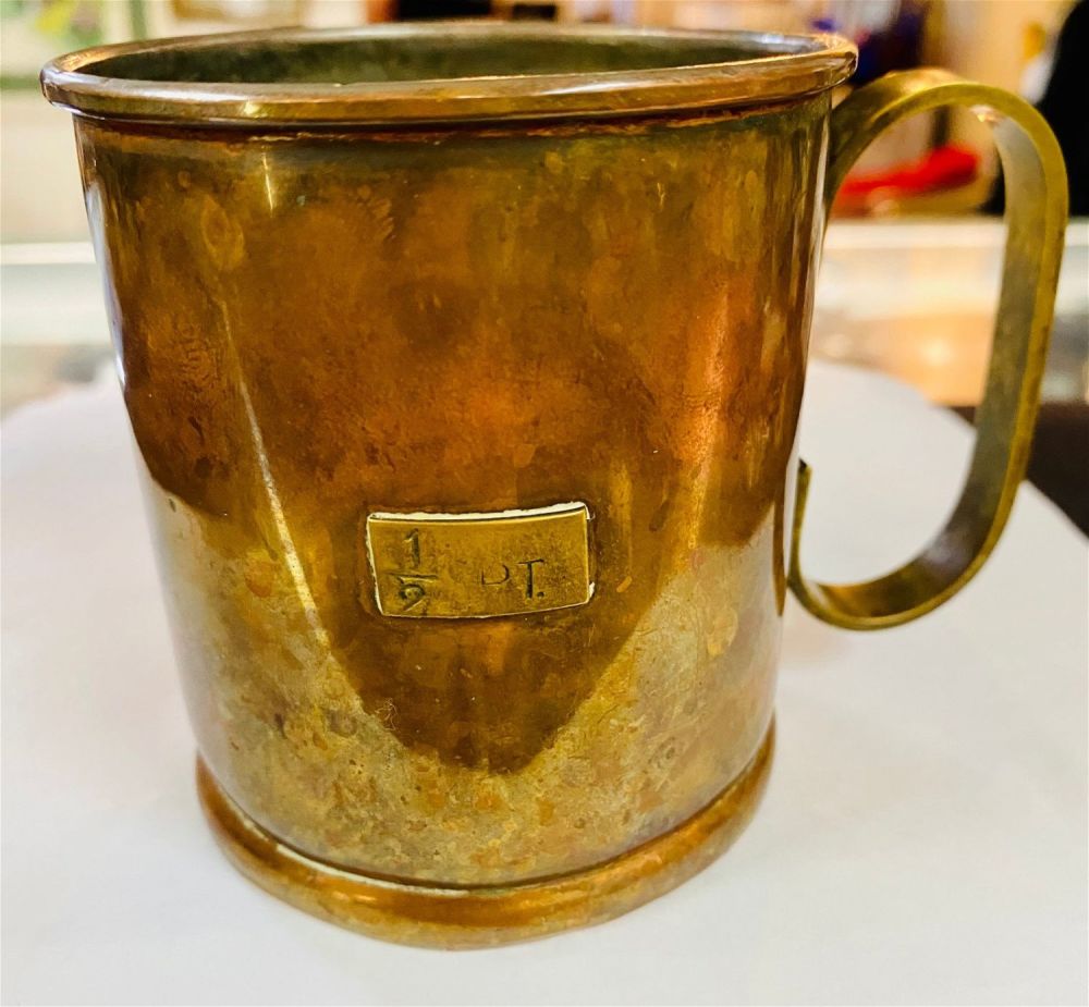 Lot 285: Copper brass tankard handled