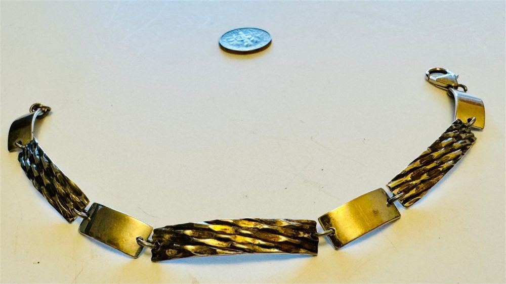 Lot 317: Sterling bracelet estate piece with link design
