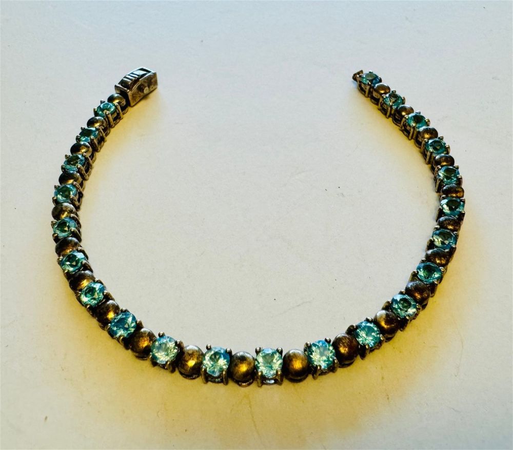 Lot 328: Blue topaz sterling bracelet straightline