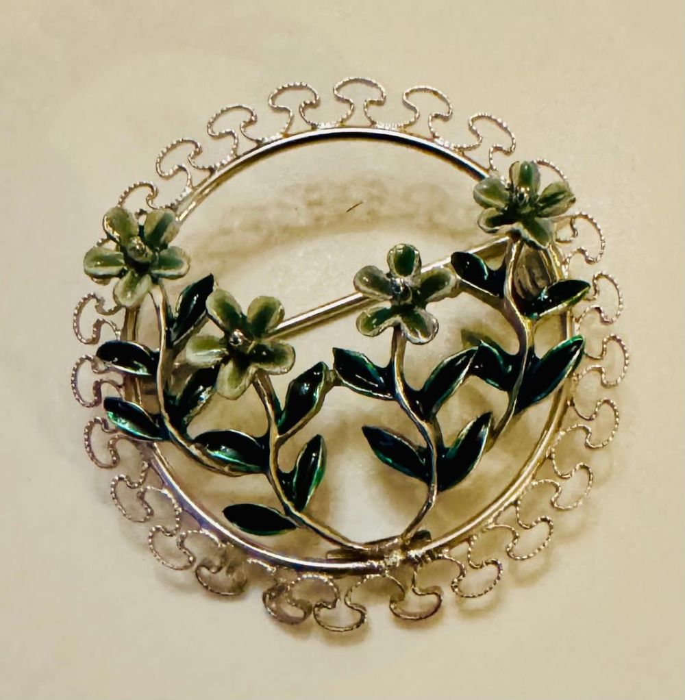 Lot 135: Sterling floral enamel Beau pin