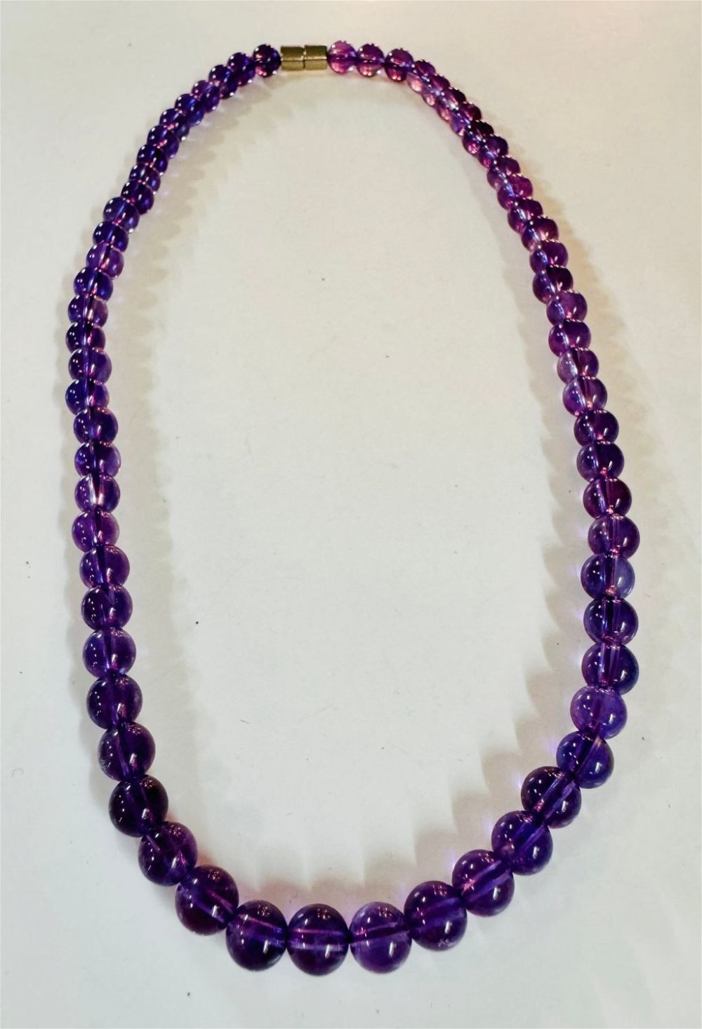 Lot 335: Amethyst bead necklace purple