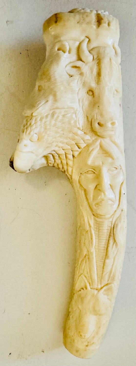 Lot 180: Carved antler Indian-animals
