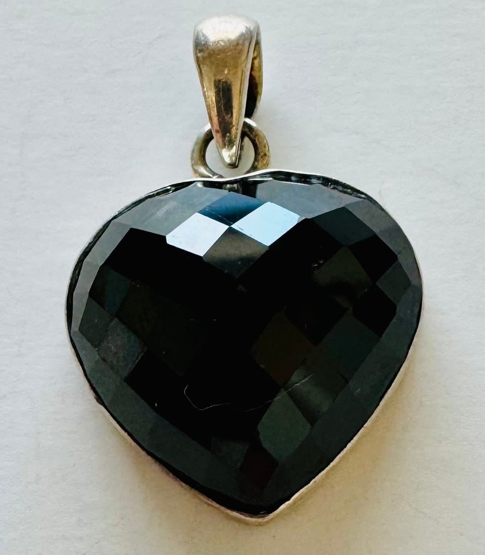Lot 191: Faceted facncy gemstone heart sterling pendant