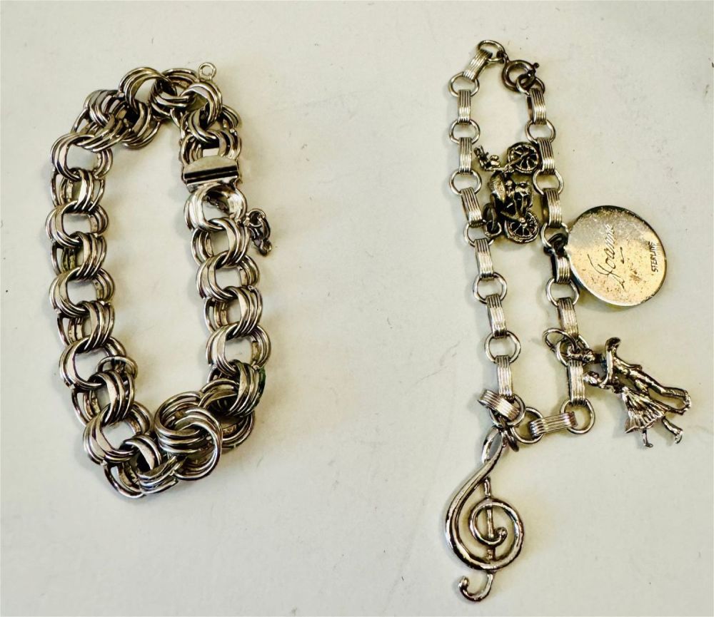 Lot 200: 2 sterling vintage charm bracelets