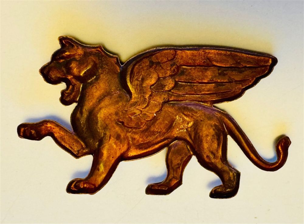 Lot 219: Winged creature/lion - brass