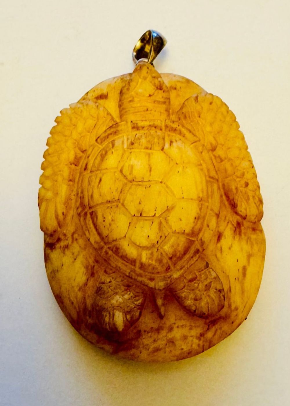 Lot 222: Bone carved turtle pendant