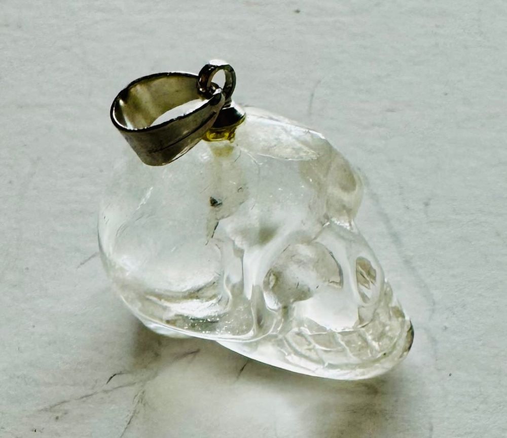 Lot 226: Clear quartz skull pendant carved