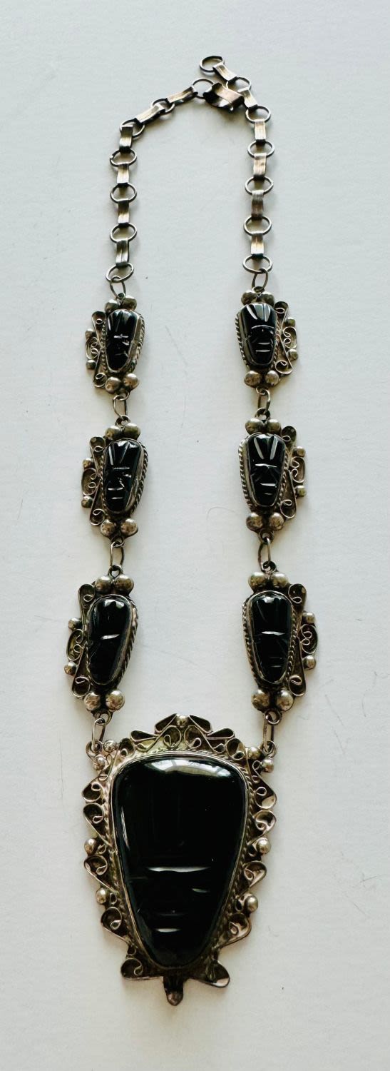 Lot 208: Mexican sterling carved mask necklace