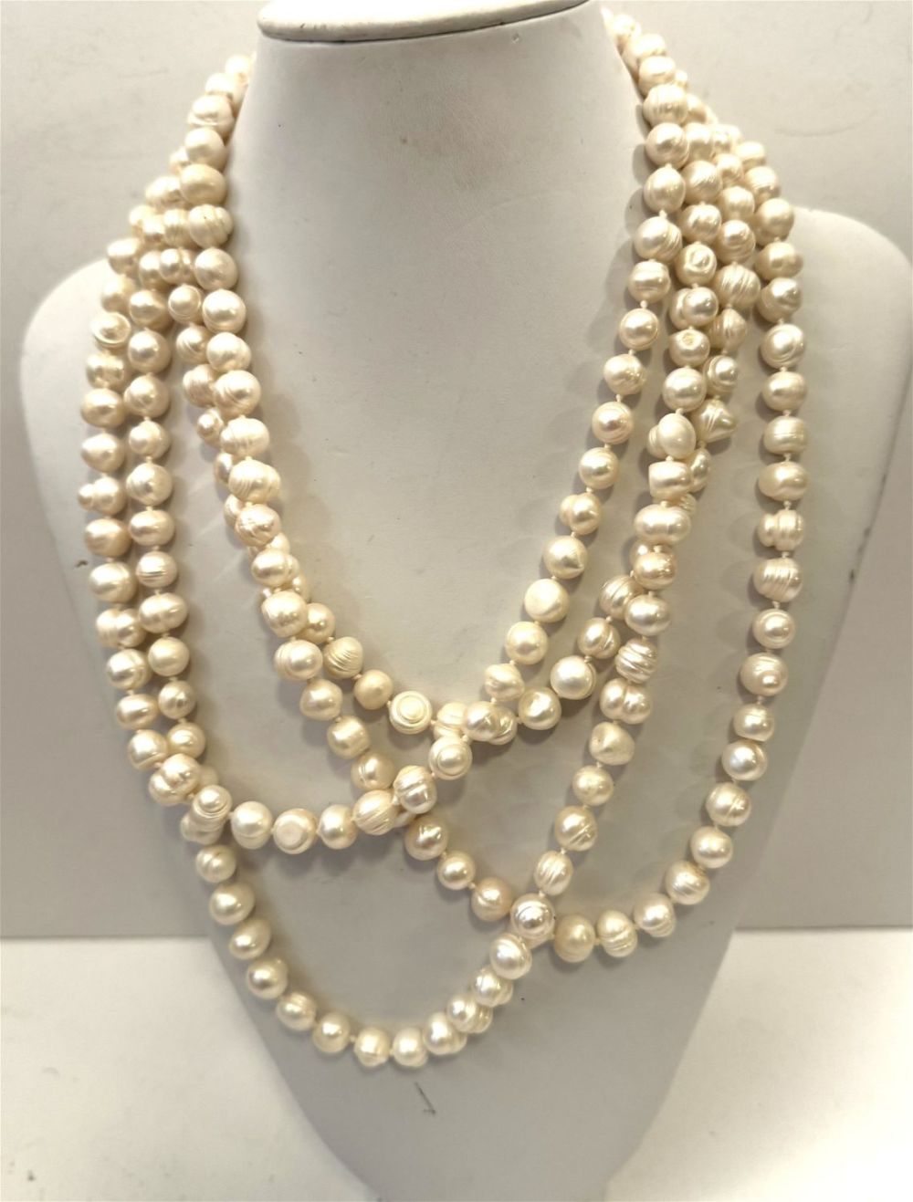Lot 239: Long baroque white pearls