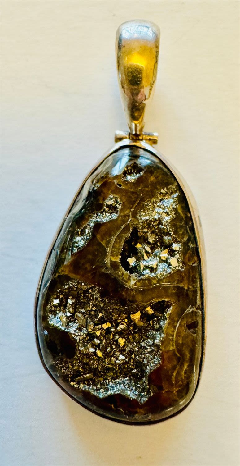 Lot 241: Pyritized ammonite sterling pendant