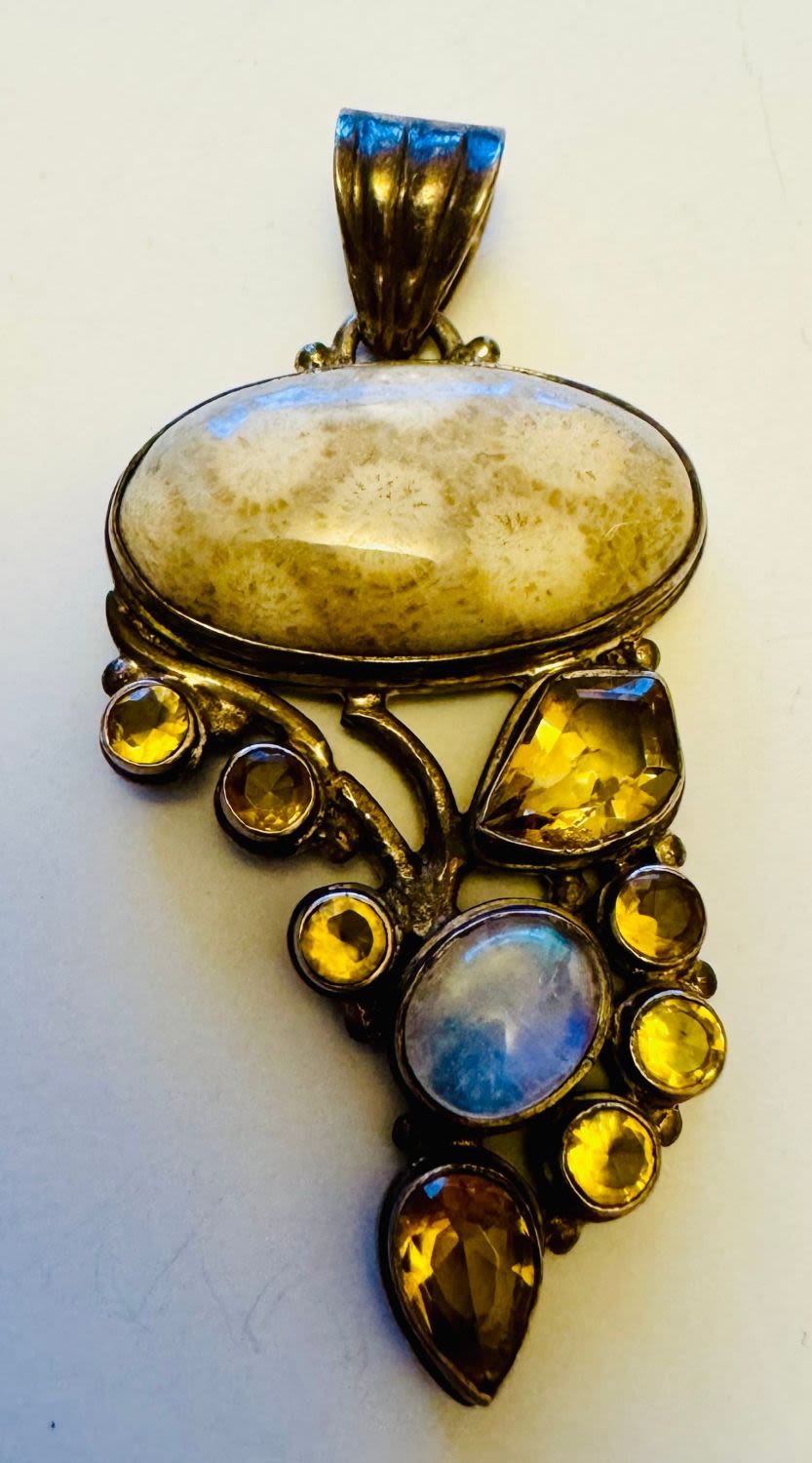 Lot 244: Coral oval cabochon gemstone sterling pendant