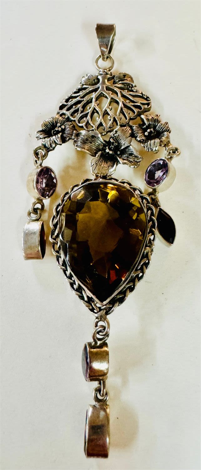 Lot 247: Smoky quartz faceted sterling pendant/genmstones