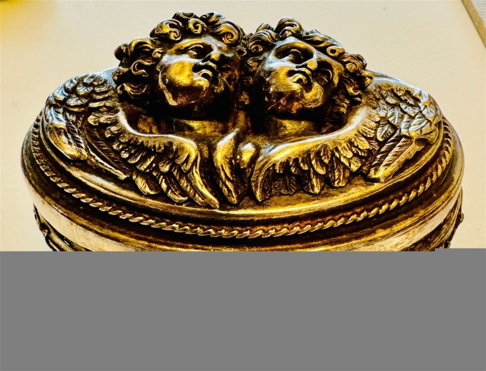 Lot 255: Signed sterling repousse H Winograd cherub box