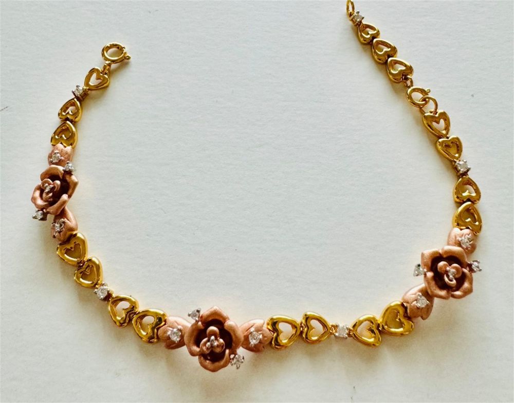 Lot 267: 3 color sterling flower bracelet.
