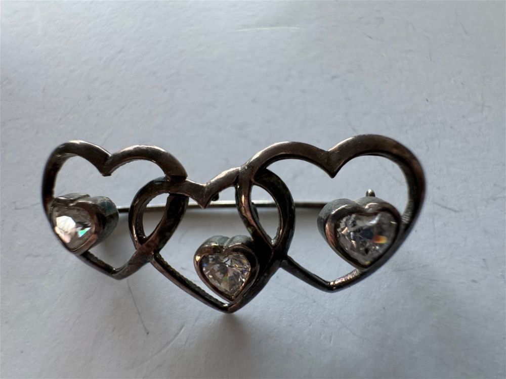 Lot 296: Triple heart sterling pin with heart shaped stones in each heart -- nice condition and about 2