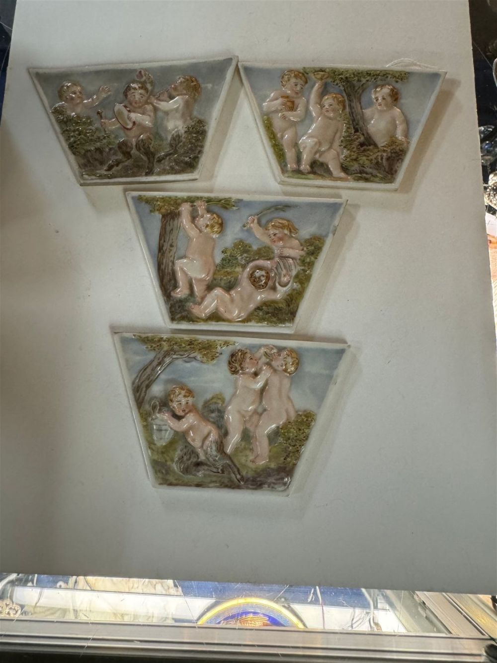 Lot 337: 4 bisque perium antique cherub plaques