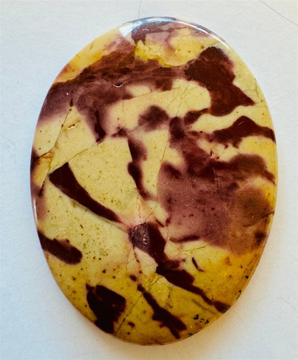 Lot 426: Jasper zebra oval cabochon stone.