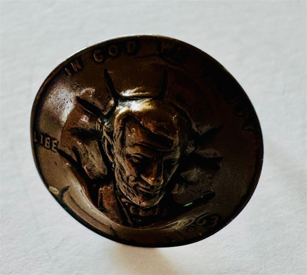 Lot 272: Copper Lincoln penny ring repousse