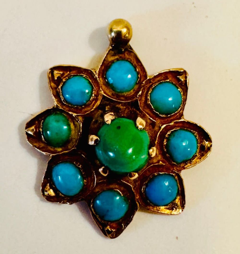 Lot 117: Turquoise gold pendant - star shape