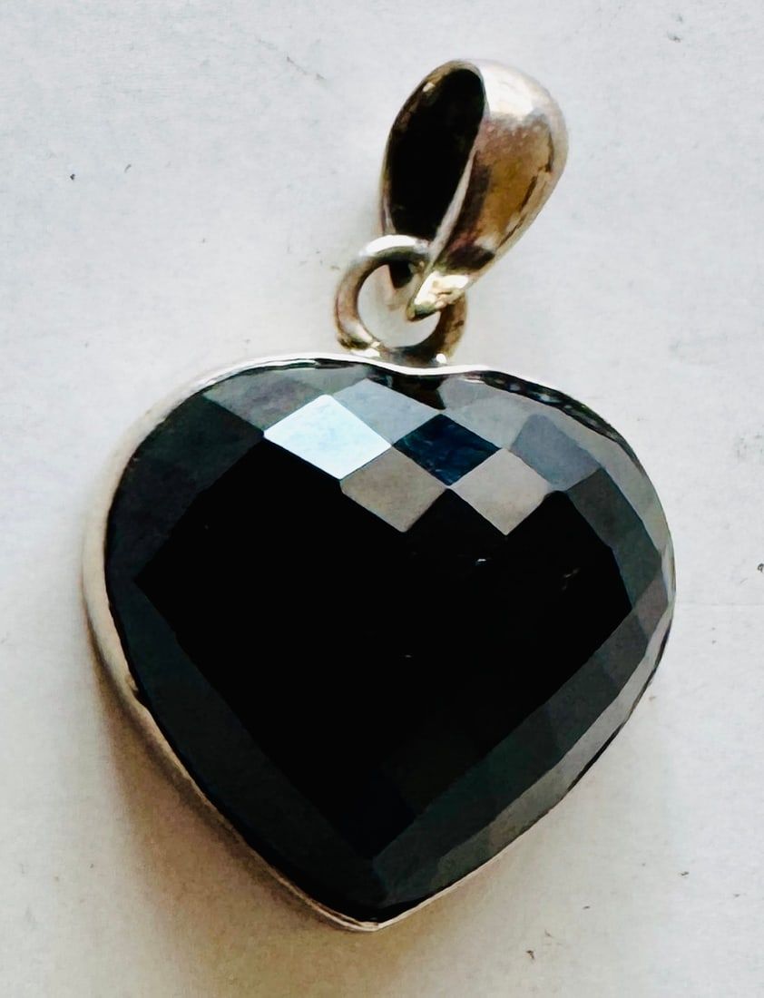 Lot 180: Sterling bezel set smoky quartz heart