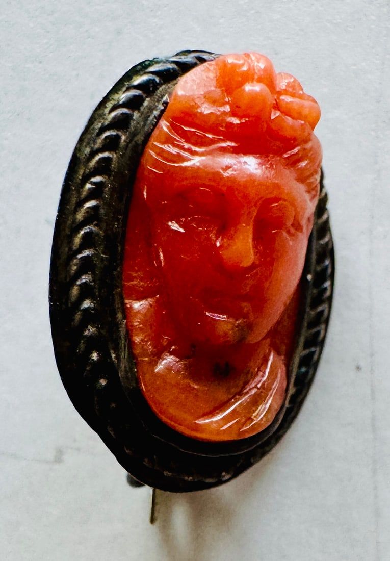 Lot 203: Carved coral pin antique