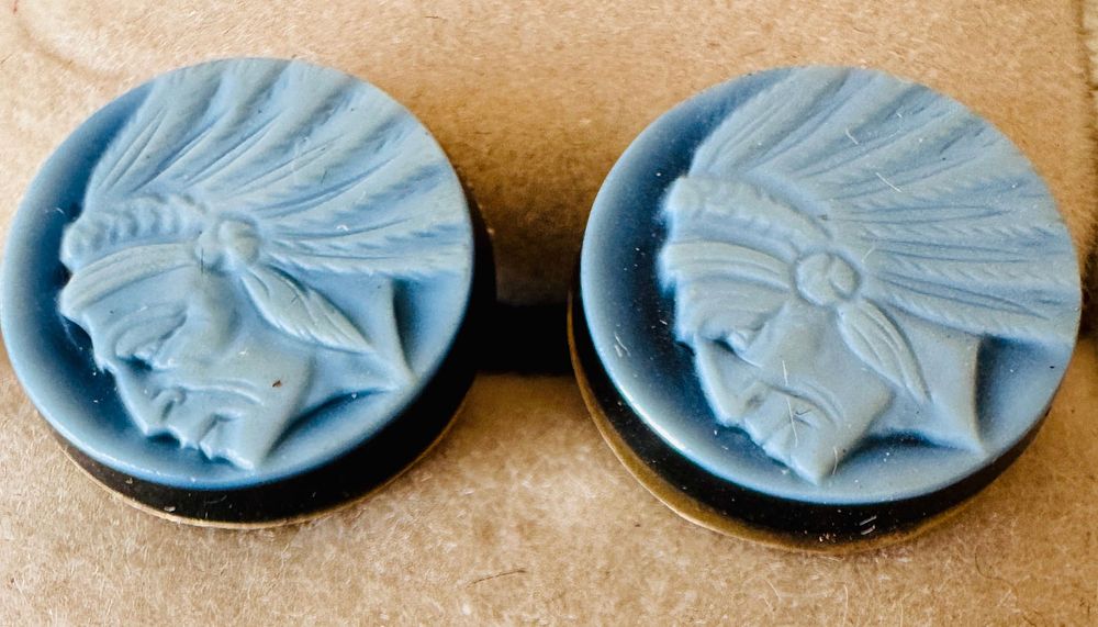 Lot 207: Indian head 14k earrings carved