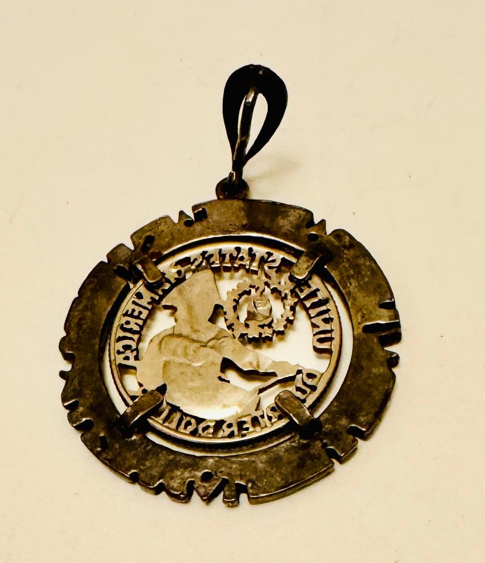 Lot 223: Cut out American silver quarter pendant