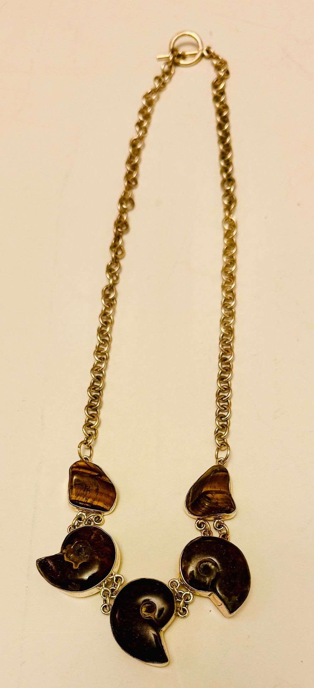 Lot 224: Ammonite fossil sterling necklace