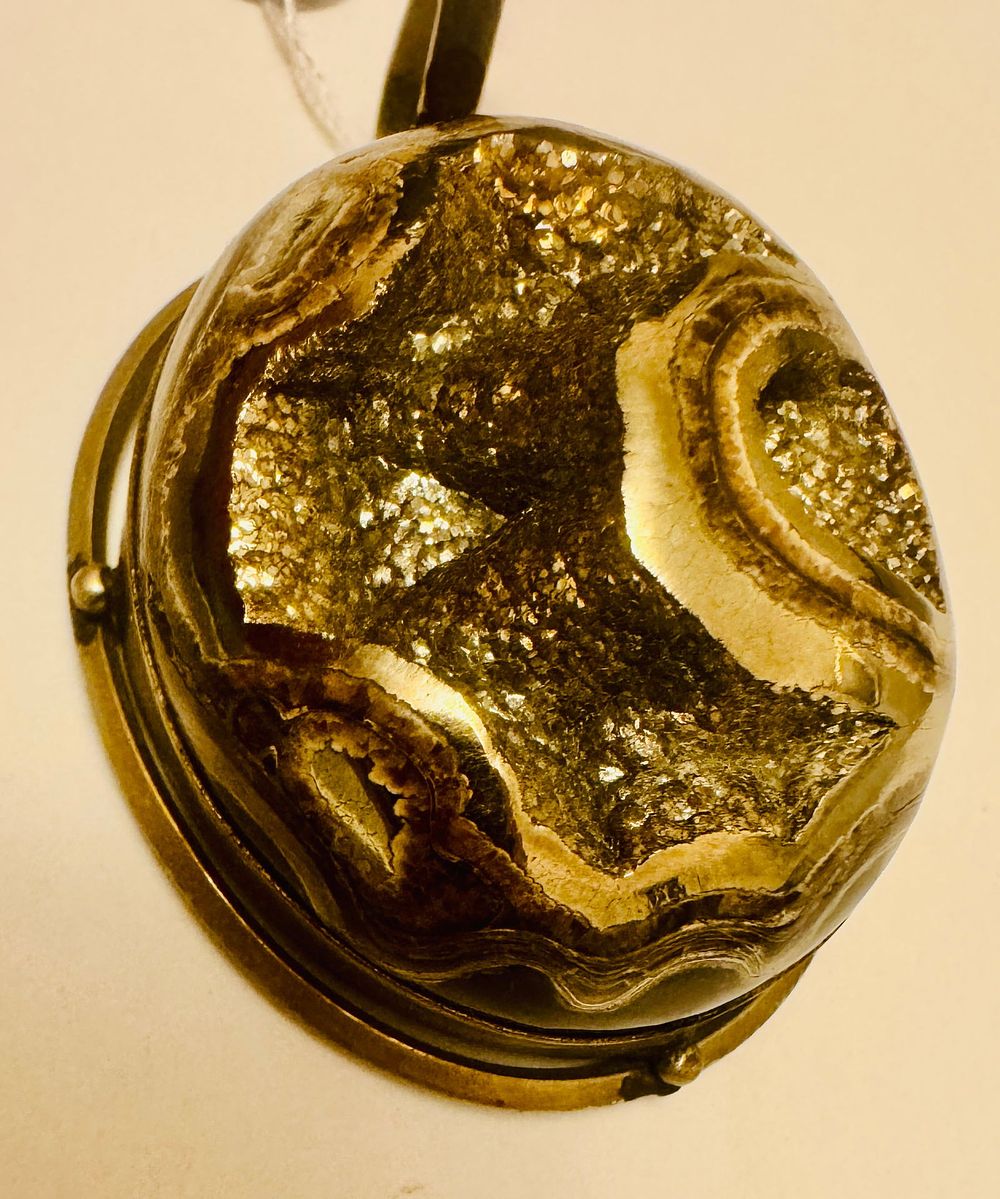 Lot 230: Pyritized ammonite sterling pendant