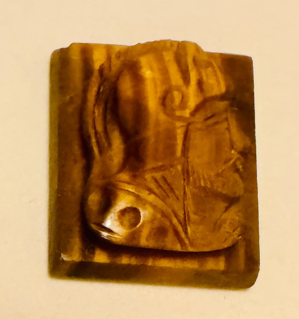 Lot 235: Tiger eye carved knight head