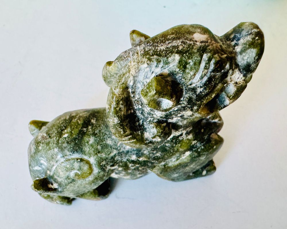 Lot 340: Hardstone Red Mountain animal figure shroud weight