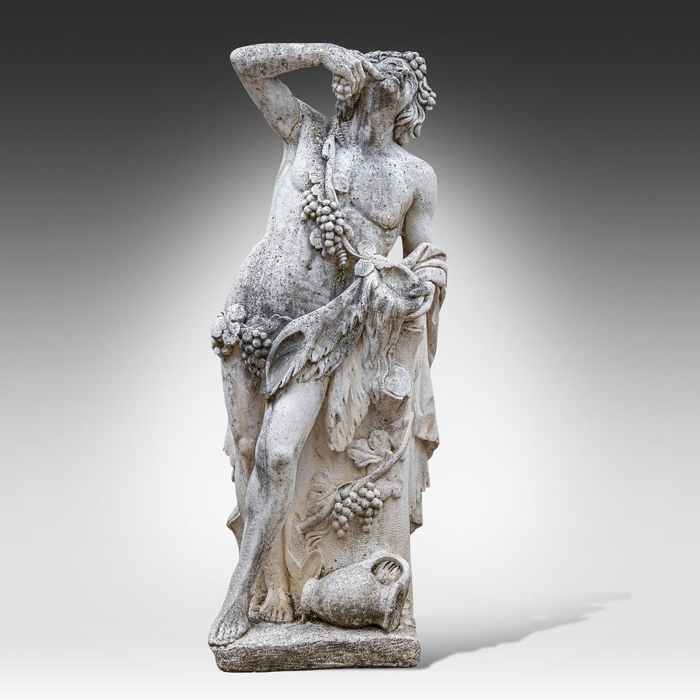 A composite stone garden figure of Bacchus 140 x 54 x 38 cm. (55.1 x 21.2 x 14.9 in.). A 