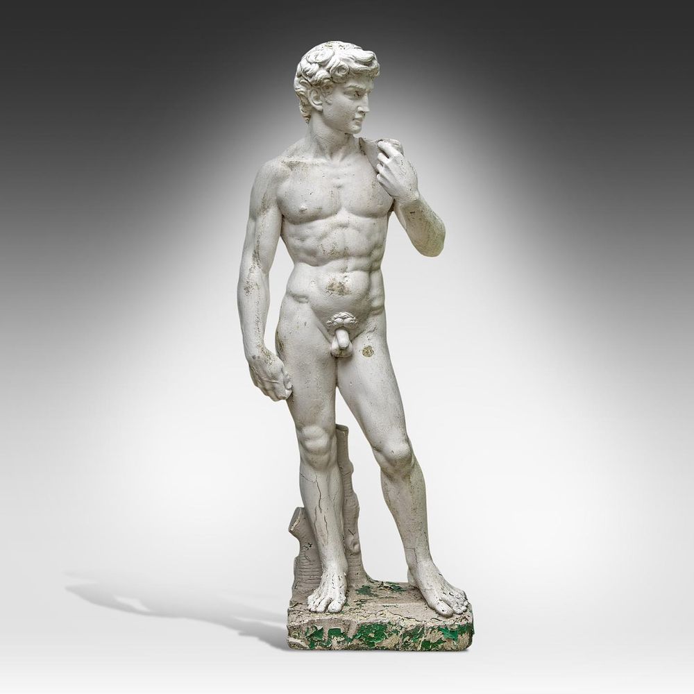 A composite stone garden sculpture of David, after Michelangelo 170 x 60 x 45 cm. (66.9 x 23.6 