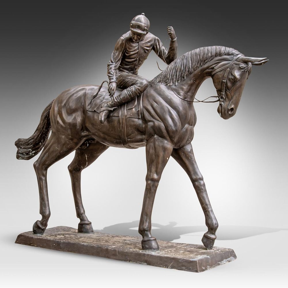 A bronze statue of a jockey 218 x 265 x 76 cm. (85.8 x 104.3 x 29.9 in.). A bronze statue of a 