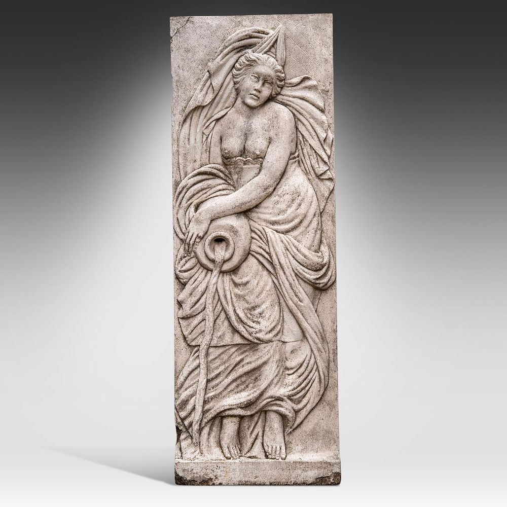 A composite stone relief of a river nymph 197 x 68 x 14 cm. (77.5 x 26.7 x 5.5 in.). A 