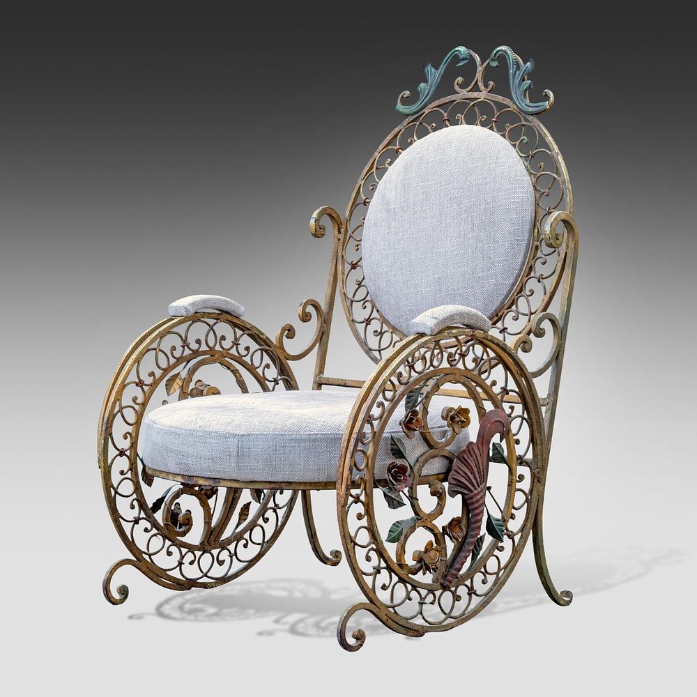 A late 19thC French wrought iron polychrome decorated garden chair 108 x 70 x 78 cm. (42.5 x 