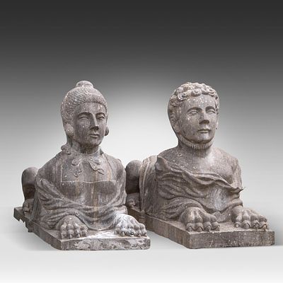 A pair of sphinxes in blue stone 80 x 43 x 116 cm. (31 1/2 x 16.9 x 45.6 in.). A pair of 