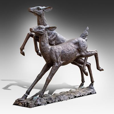 A bronze sculpture of two running deer 143 x 159 x 62 cm. (56.3 x 62.6 x 24.4 in.). A bronze 