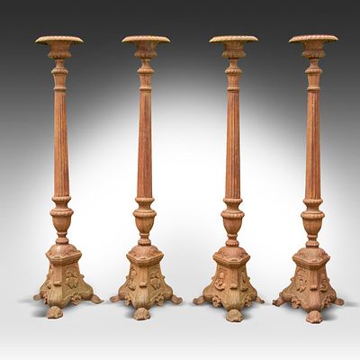 A set of four cast-iron church candle cticks 187 x 54 x 47 cm. (73.6 x 21.2 x 18 1/2 in.). A 