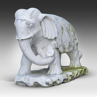 A marble sculpture of an Indian elephant 80 x 100 x 52 cm. (31 1/2 x 39.3 x 20.4 in.). A marble 
