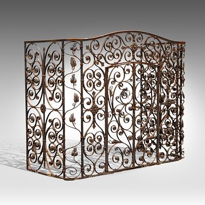 A wrought iron floral decorated fire screen, 19thC 130 x 153 x 66 cm. (51.1 x 60.2 x 25.9 in.). 