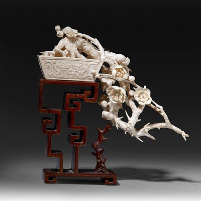 A fine Chinese 'potted plum' scholar's ivory sculpture, Qing dynasty (late 19th/early 20thC) 