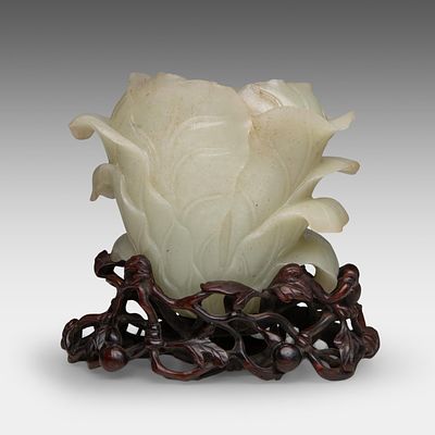 A Chinese jade 'Cabbage' water pot, fitted on a finely carved 'Gourds and Vines' wooden stand 