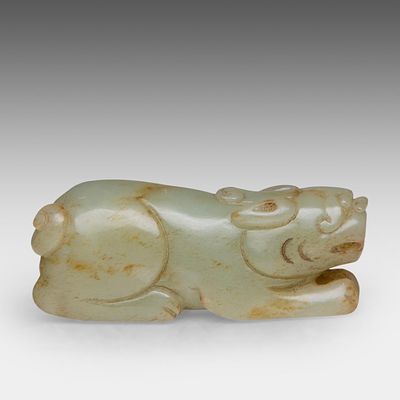 A Chinese jade carving of a recumbent lion, Yuan/Ming style, L 8 cm. A Chinese jade carving of 