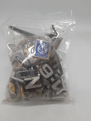 Bag of car badges etc.