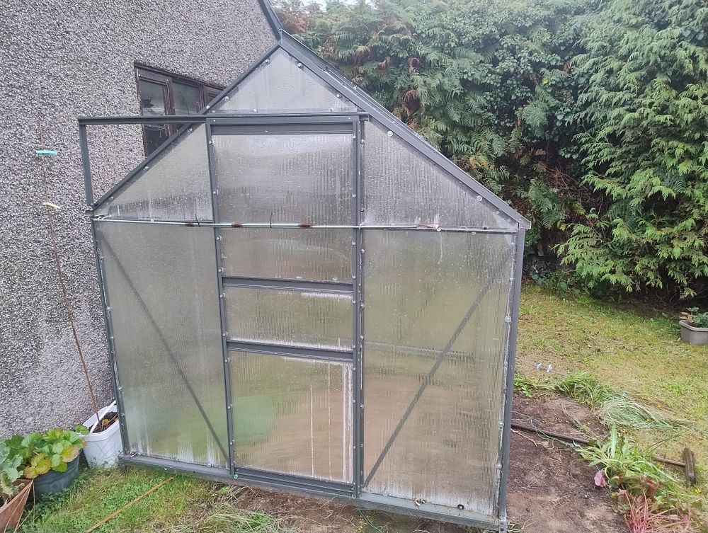 one season used greenhouse with boxes and papers UNABLE TO POST