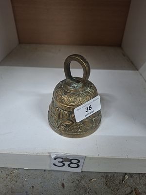 vintage brass bell with pelicans, dog, lion, etc - very heavy for size