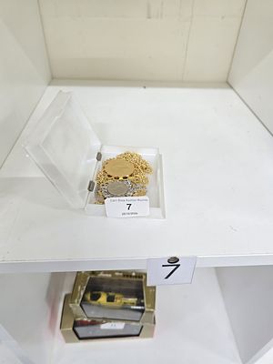 coin pendant necklaces in plastic case